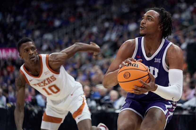 TCU forward Chuck O'Bannon Jr., right, gets past Texas guard Sir'Jabari Rice (10) to put up...