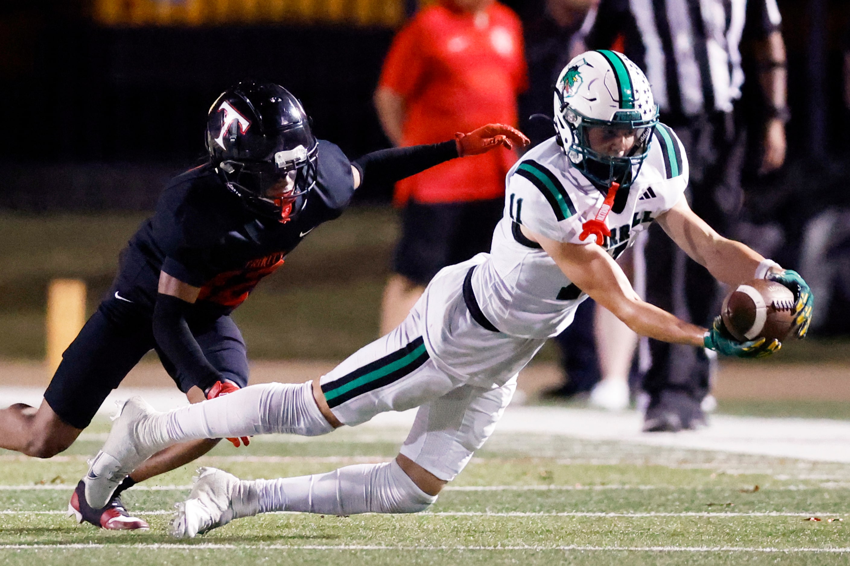 Southlake Carroll wide receiver Brock Boyd (11) lays out to make a catch ahead of Euless...