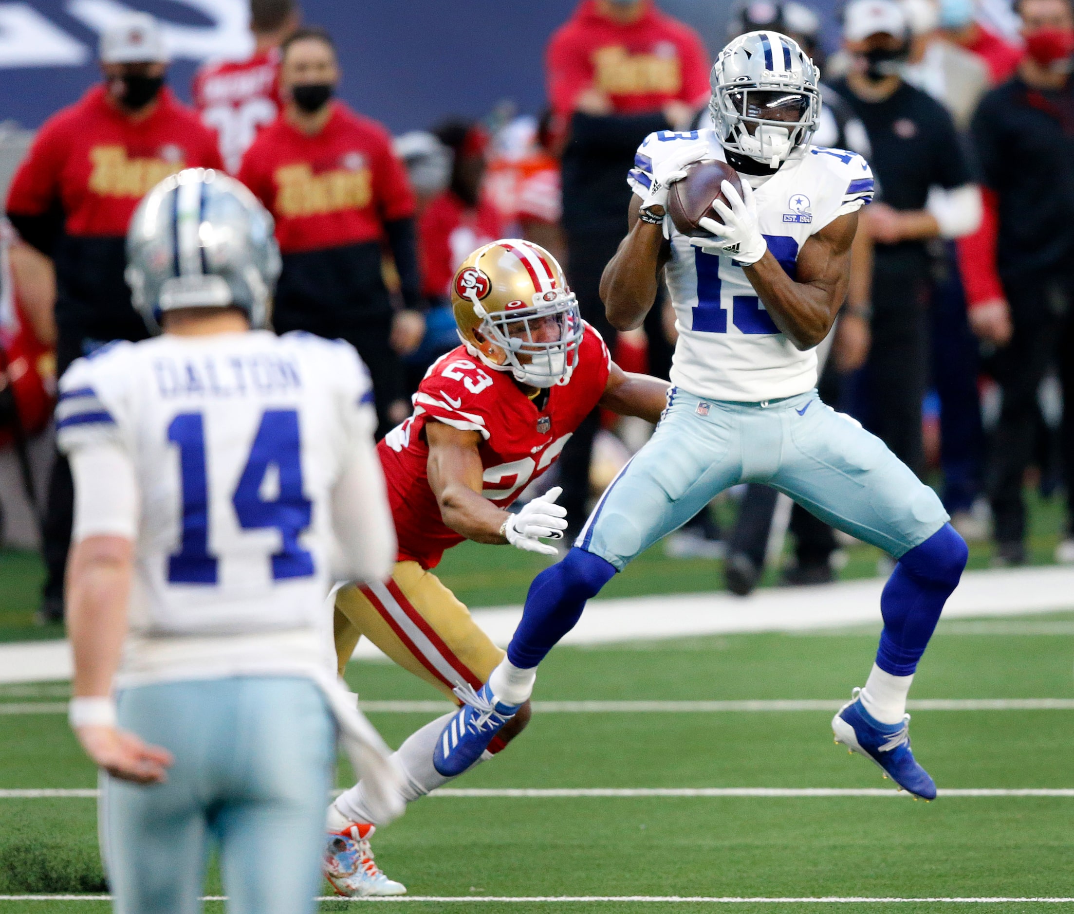 Dallas Cowboys wide receiver Michael Gallup (13) caches a pass from quarterback Andy Dalton...