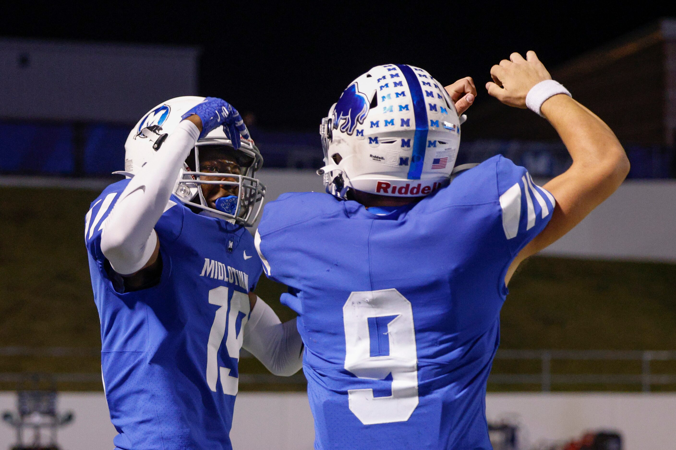 Midlothian wide receiver Bryant Wesco (19) celebrates a touchdown with quarterback Chad...