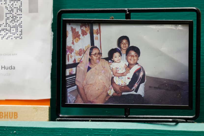 A family photo of SauceBros Pizza co-owner Redwan Huda, his grandmother and sisters, sits in...