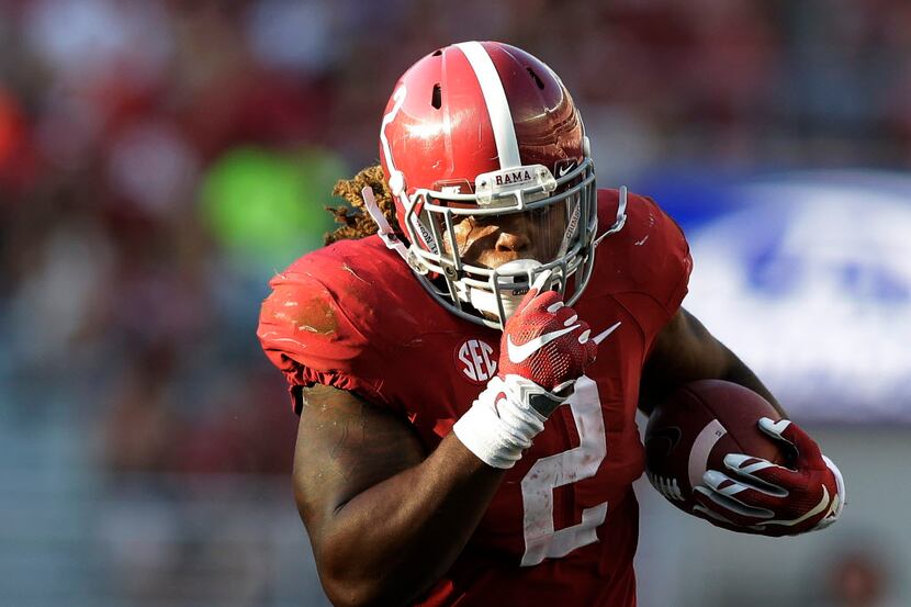 FILE - In this Sept. 12, 2015, file photo Alabama running back Derrick Henry (2) runs for a...