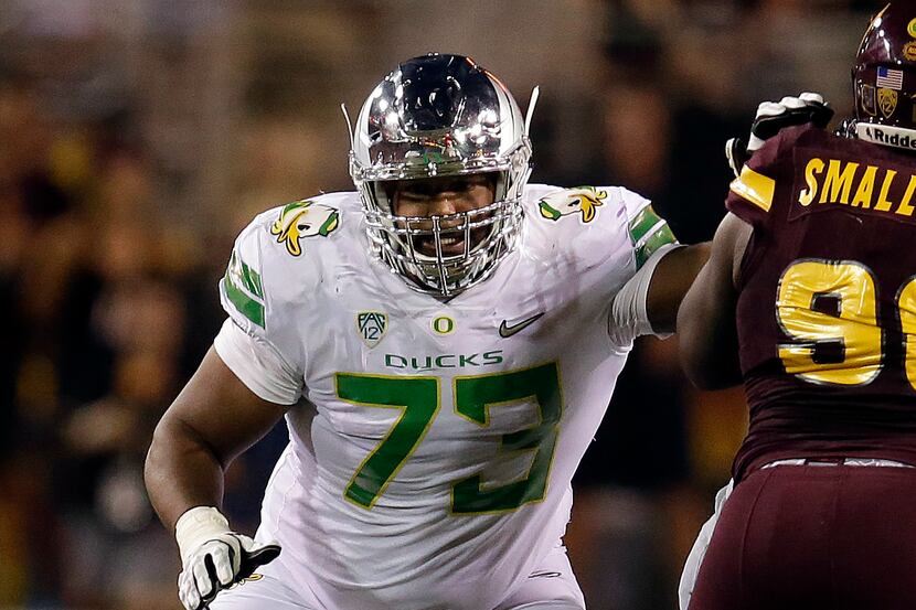FILE - In this Sept. 23, 2017, file photo, Oregon offensive lineman Tyrell Crosby (73) plays...