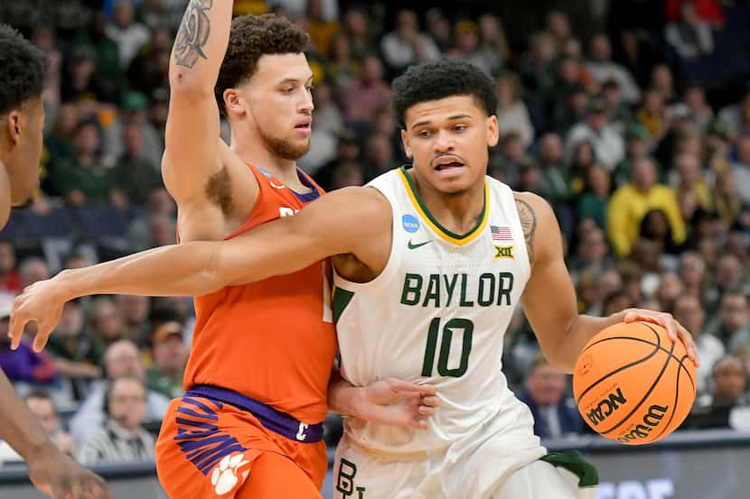 Baylor guard RayJ Dennis (10) dribbles the ball past Clemson guard Chase Hunter (1) during...