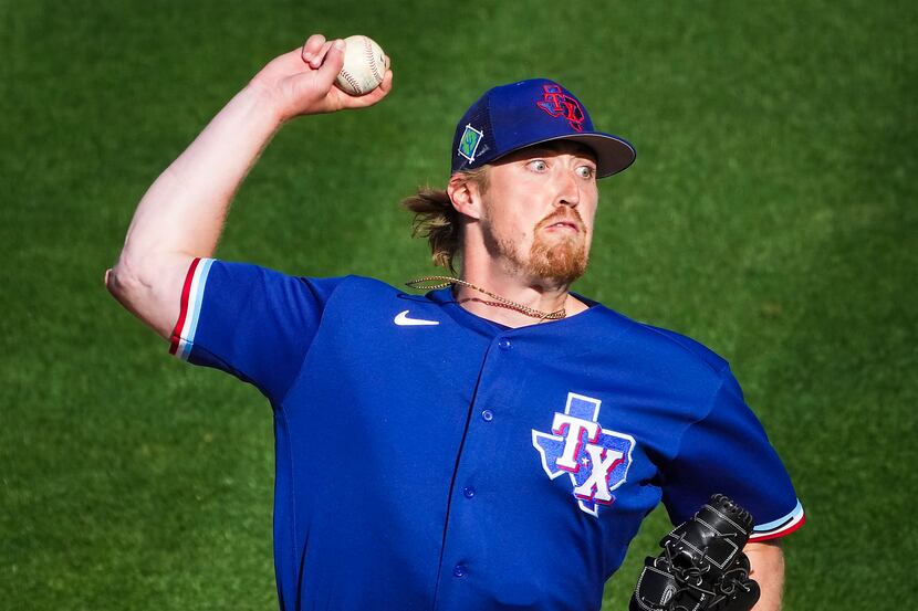 Texas Rangers pitcher Daniel Robert delivers during the ninth inning of a spring training...