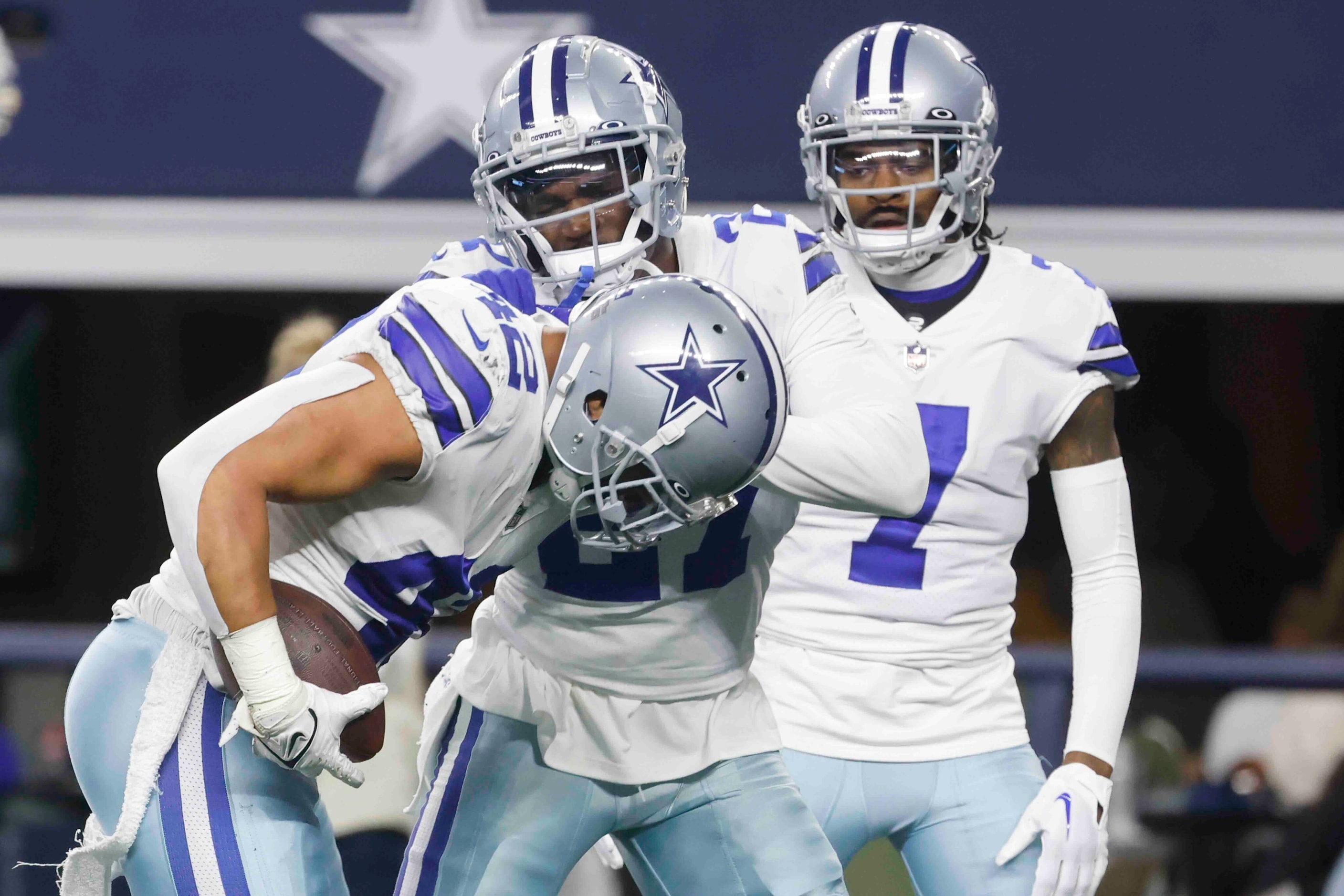 Dallas Cowboys linebacker Anthony Barr (42) celebrates with teammates after recovering a...