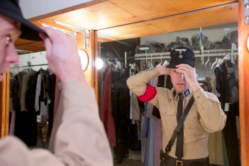 
Ryan Page, dressing in a Nazi costume for The Sound of Music at Casa Mañana Theater, has...