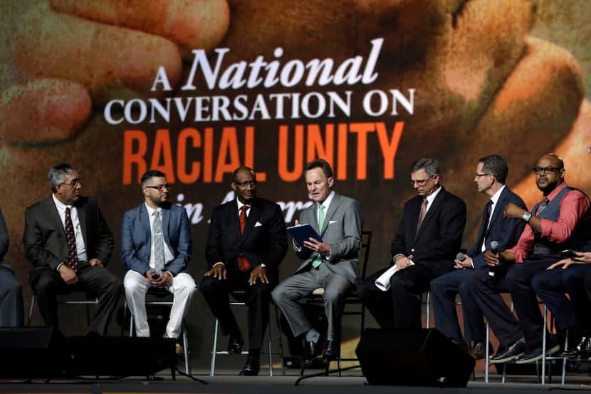 Pastor Ronnie Floyd (center), president of the Southern Baptist Convention, conducted a...