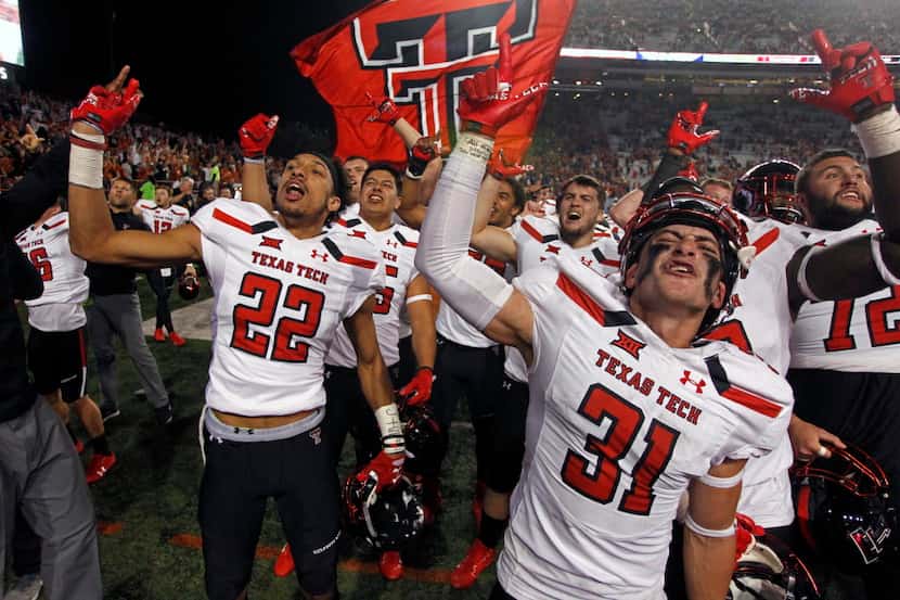 Texas Tech's Da'Leon Ward (22) and Justus Parker (31) celebrates with their teammates after...