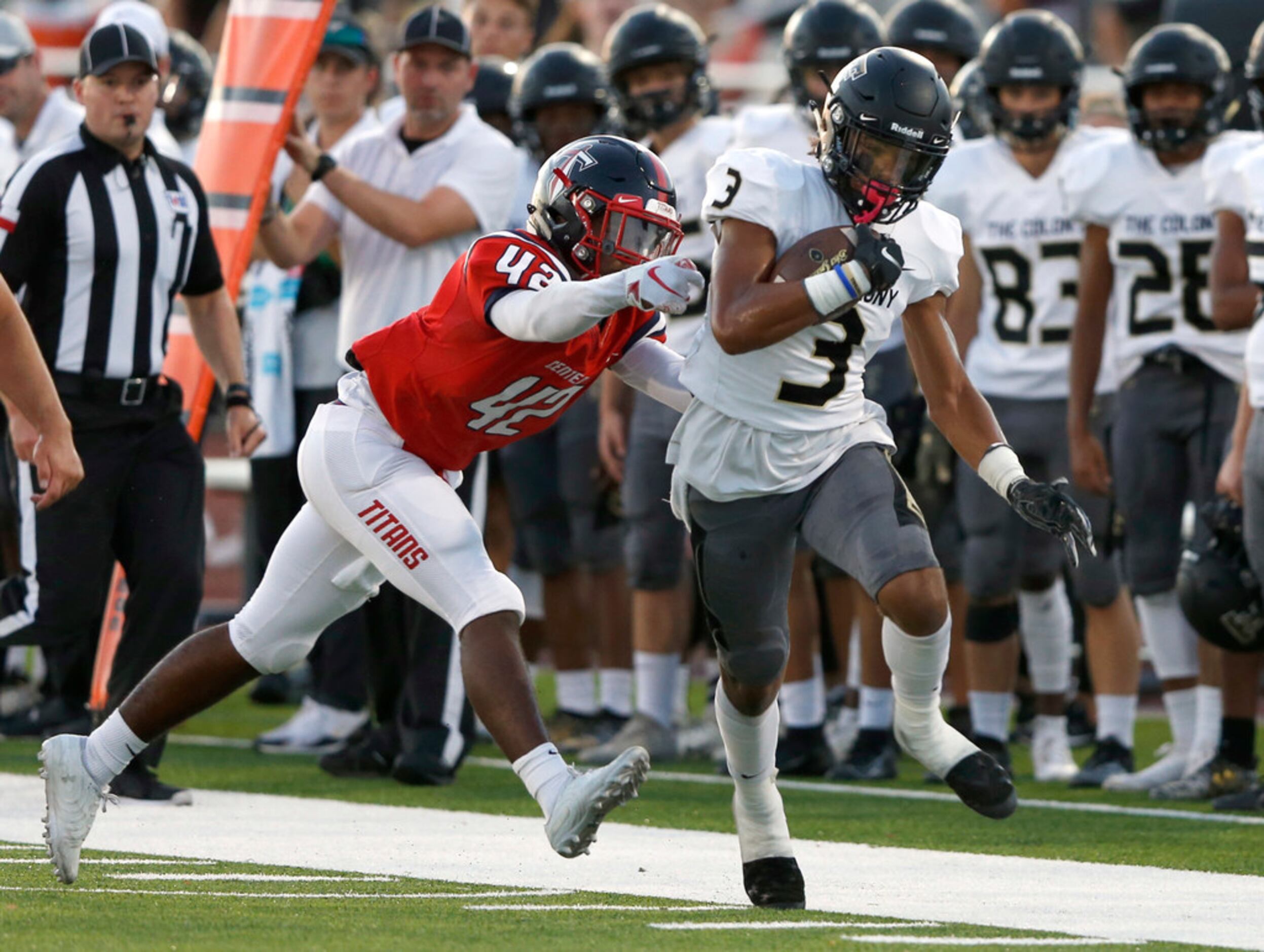 The Colony's Christian Gonzalez (3) runs up the field as Centennial's Jeremiah Mines (42)...