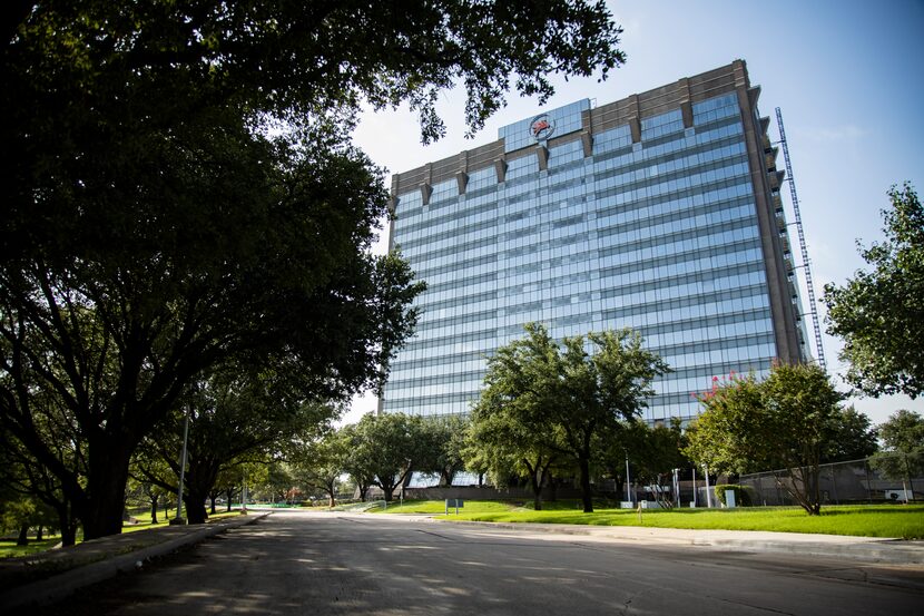 Exterior of Pegasus Park tower, the silver high-rise building at Stemmons Freeway and...