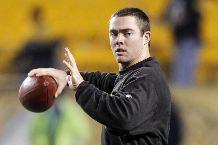 Cleveland Browns quarterback Colt McCoy passes while he warms up before the NFL football...