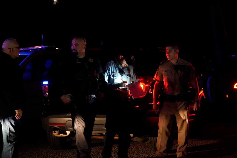 Law enforcement personnel control the scene of a shooting Monday, Jan. 23, 2023, in Half...