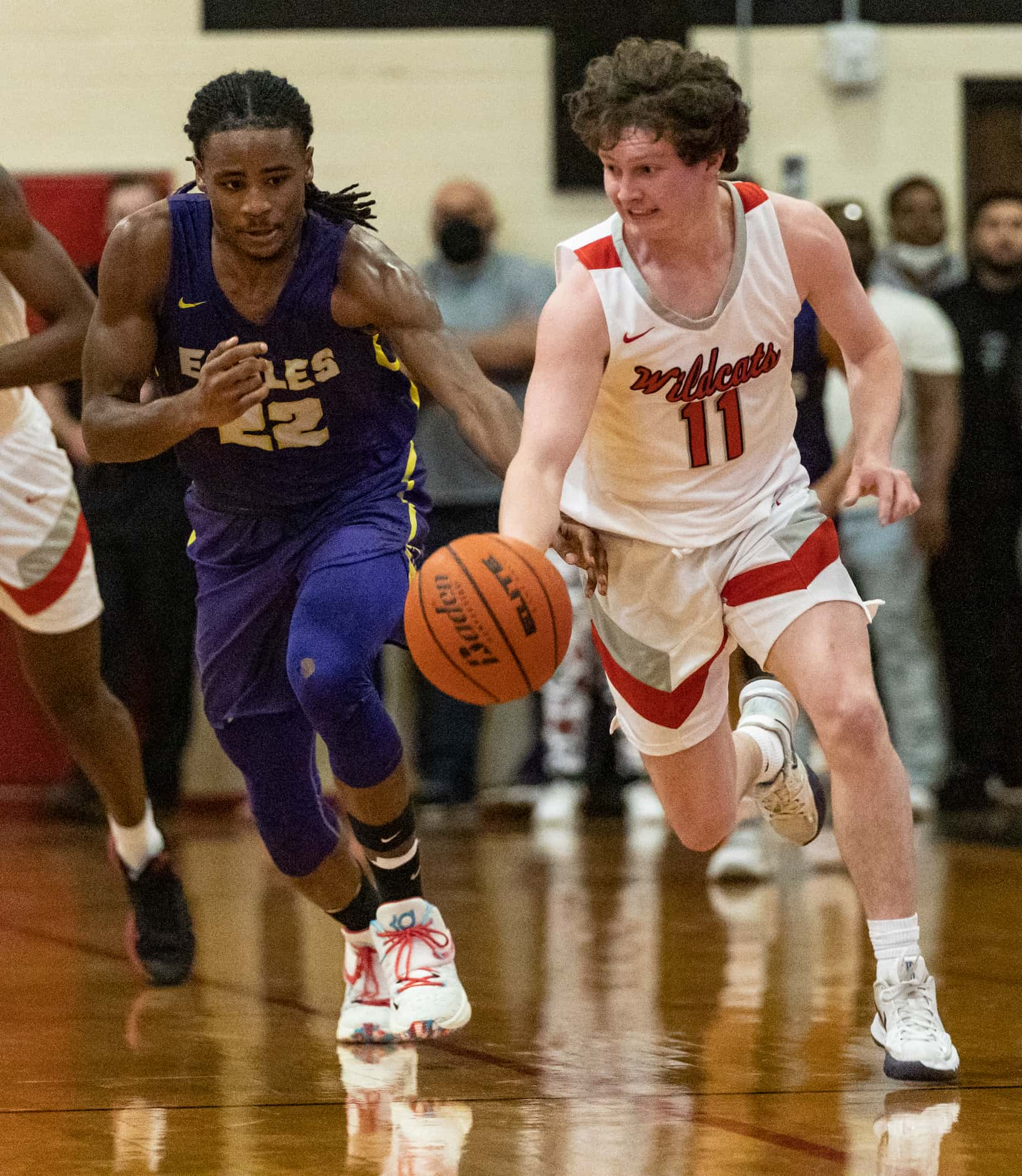 Lake Highlands High School Reid Hocker (11) dribbles the ball away from Richardson High...