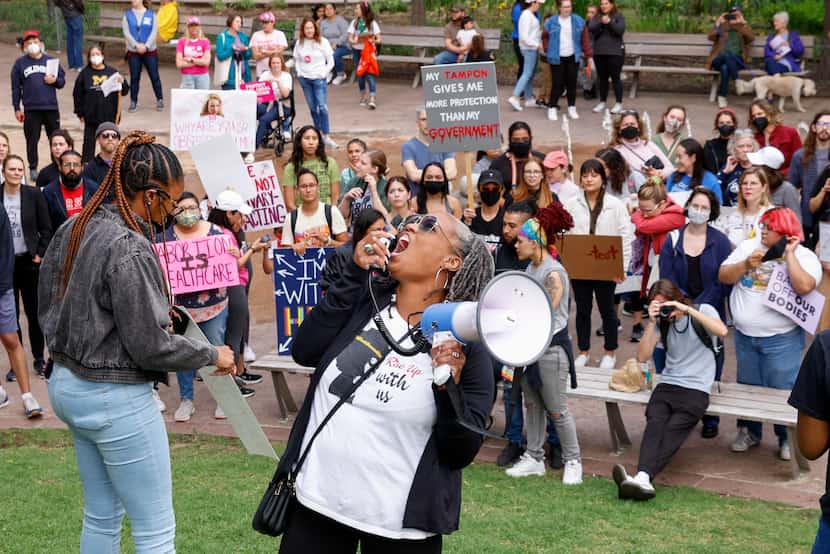 Michelle Anderson, policy assoicate at the Afiya Center, leads a chant during a rally...