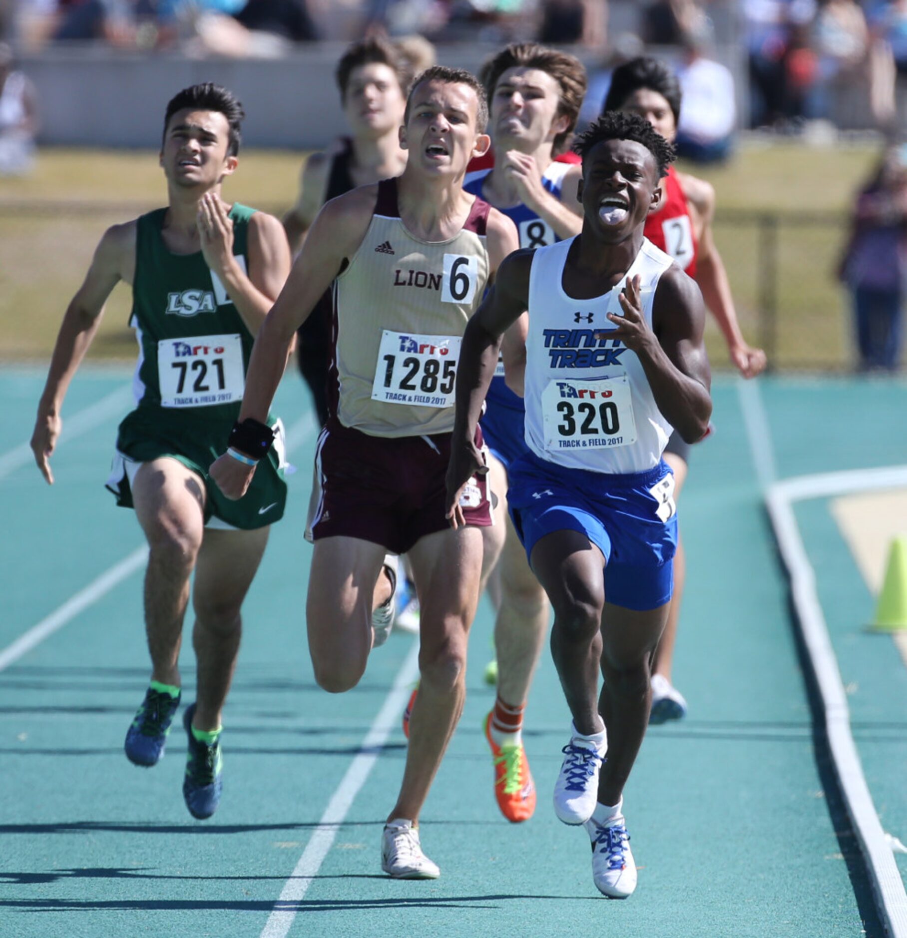 Trinity Christian Aron Starks, right, edges out SA Christian Luke Estes, left to place first...