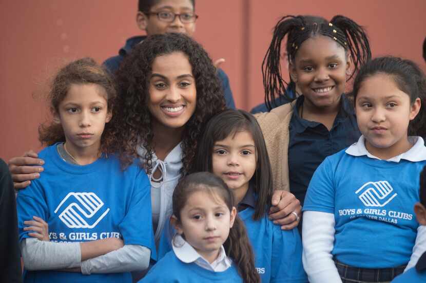Dallas Wings basketball player Skylar Diggins-Smith posed with children from the Boys &...