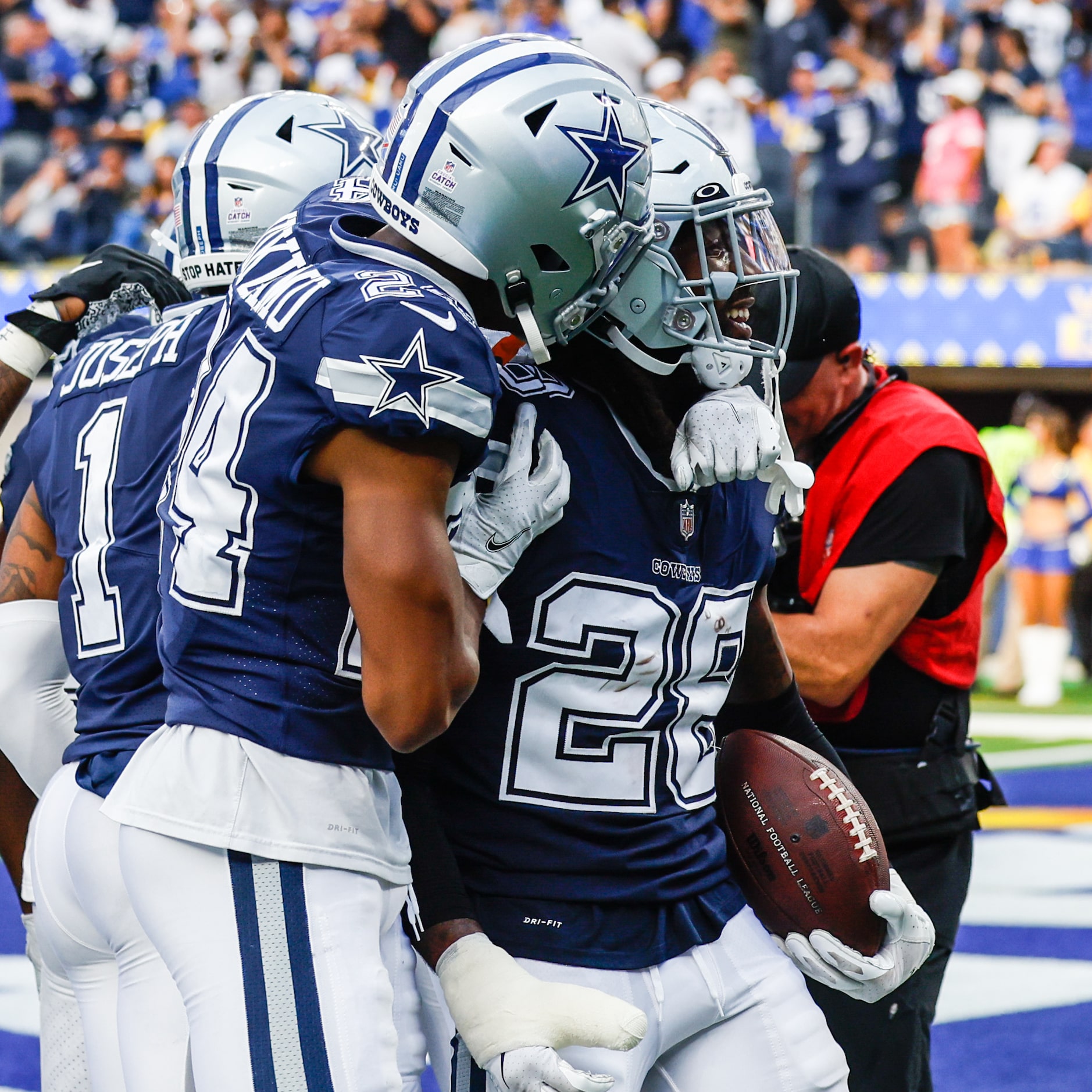 Dallas Cowboys safety Malik Hooker (28) celebrates with teammate safety Israel Mukuamu (24)...