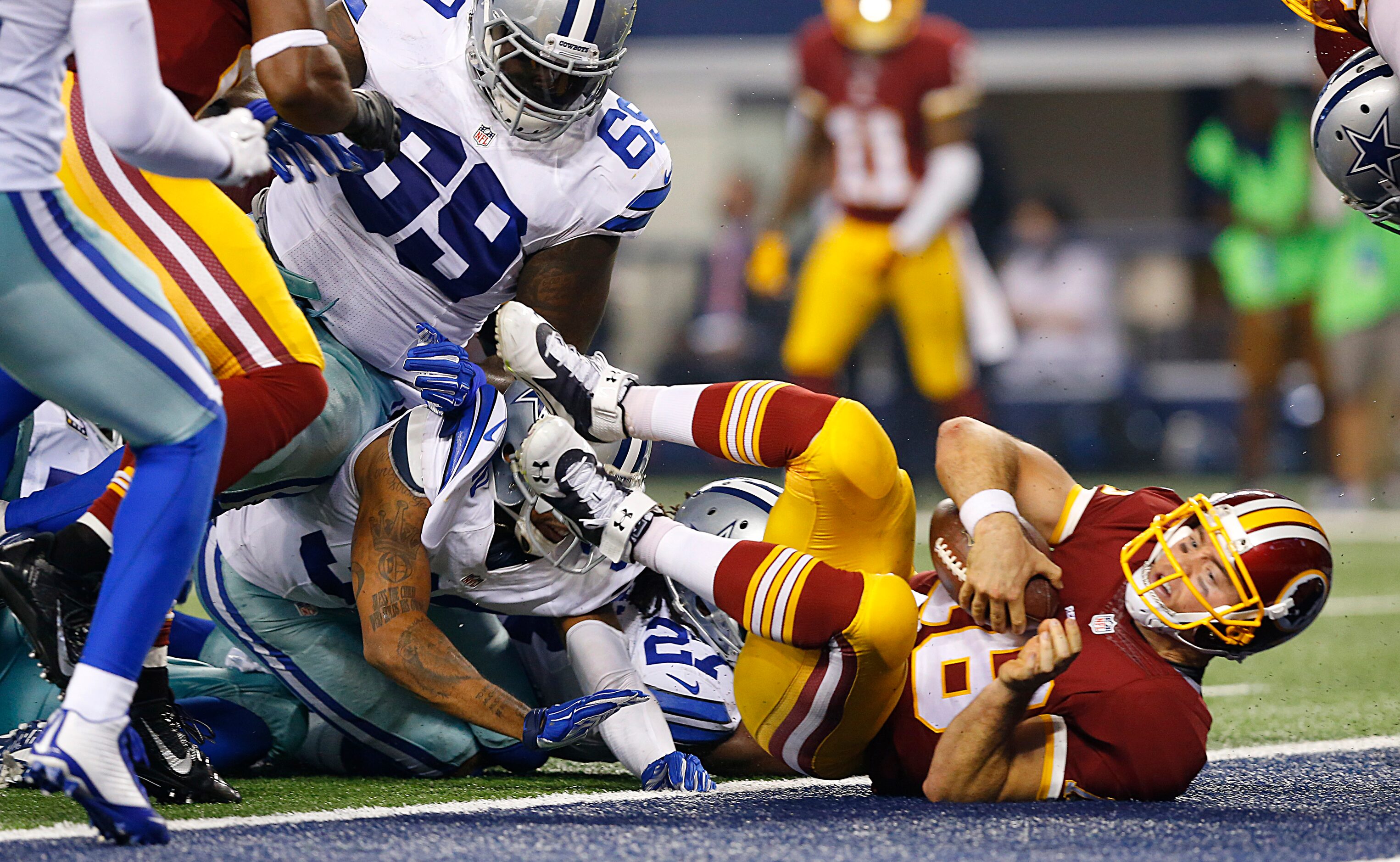 Washington Redskins quarterback Colt McCoy (16) scores a fourth quarter touchdown against...