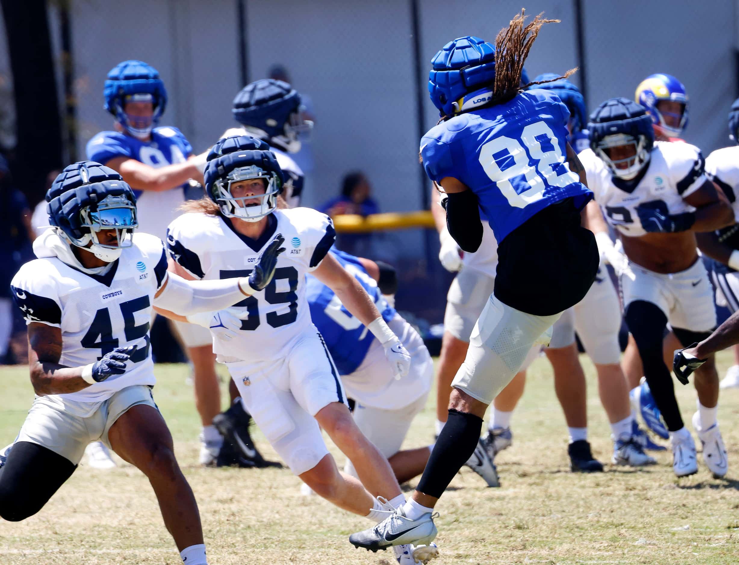 Dallas Cowboys linebackers Damien Wilson (45) and Brock Mogensen (59) watch as Los Angeles...