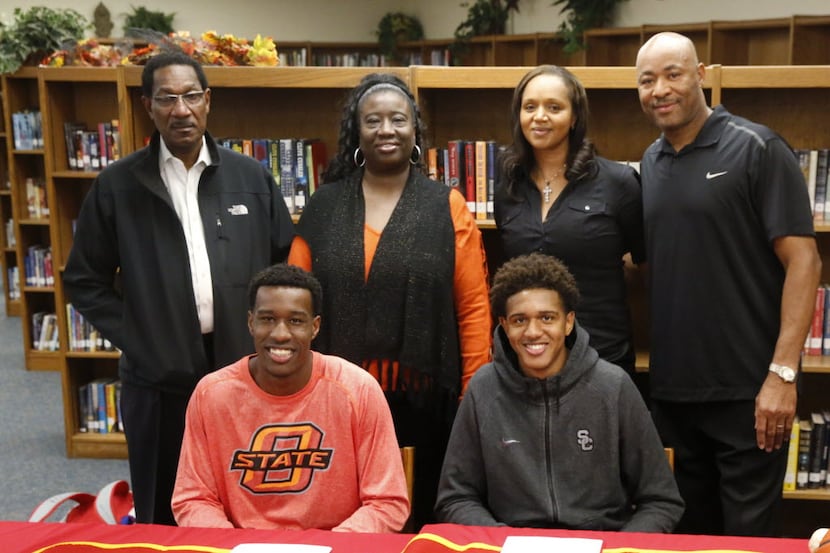 South Grand Prairie basketball player Cameron McGriff (sitting left) signed with Oklahoma...