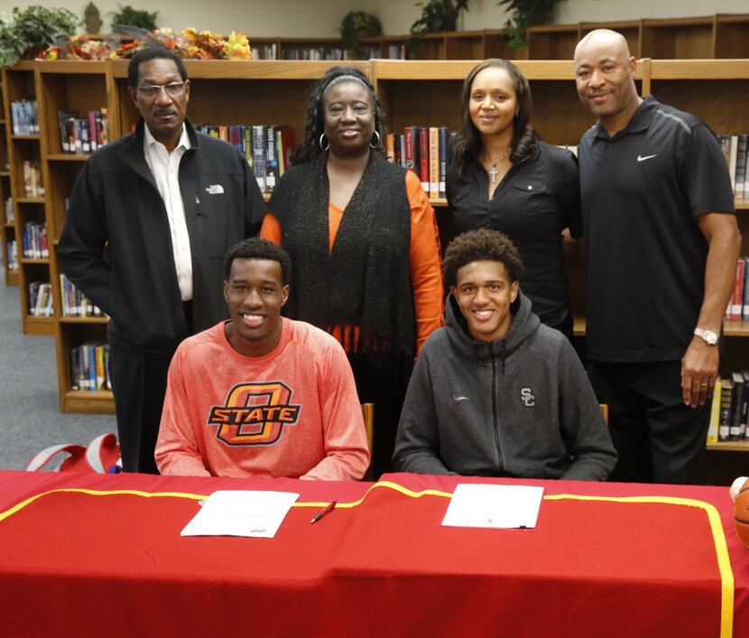 South Grand Prairie basketball player Cameron McGriff (sitting left) signed with Oklahoma...