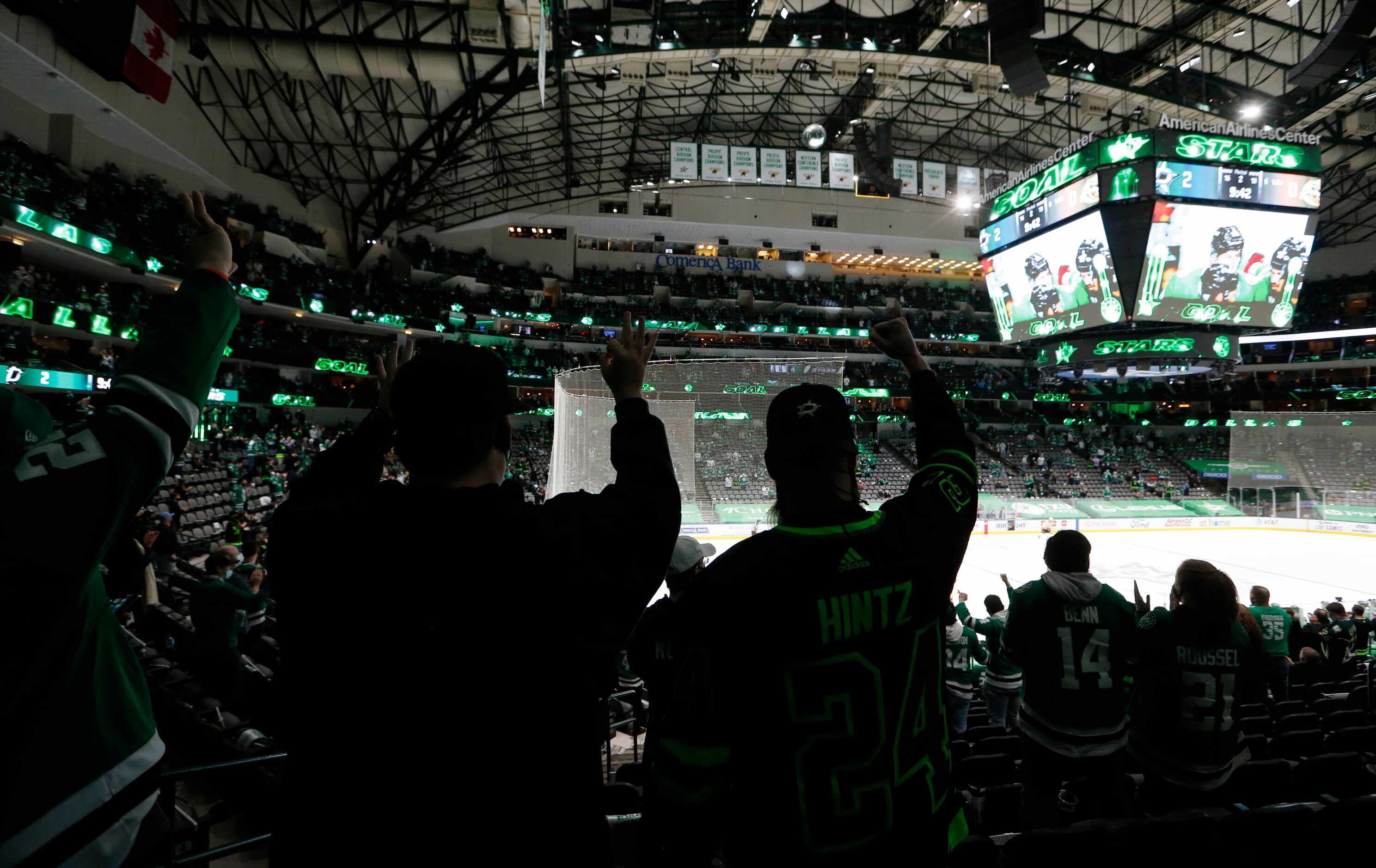 Dallas Stars fans celebrate the third goal of the game from Dallas Stars right wing Denis...
