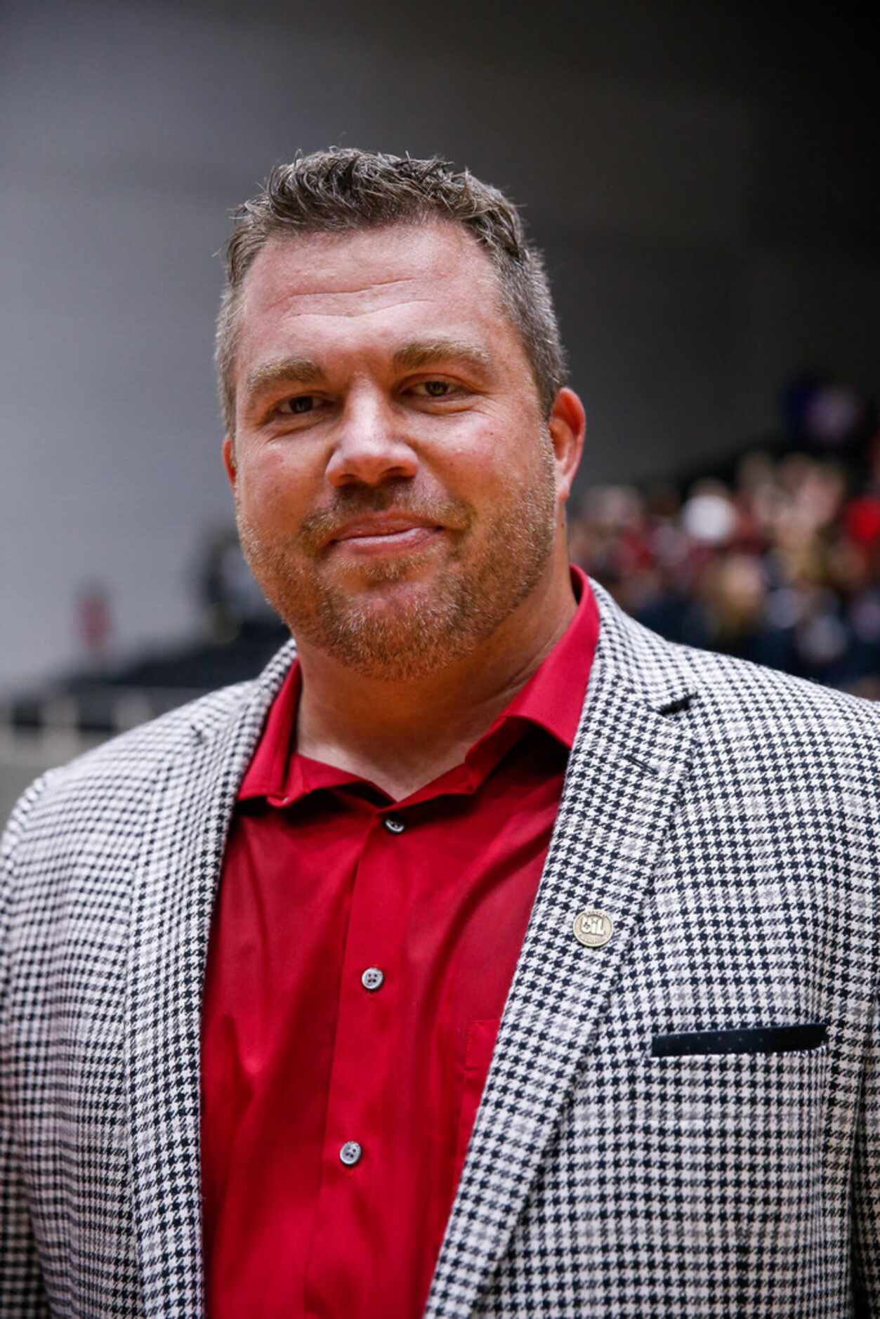 LovejoyÃs coach Ryan Mitchell poses for a photo after winning a class 5A volleyball state...