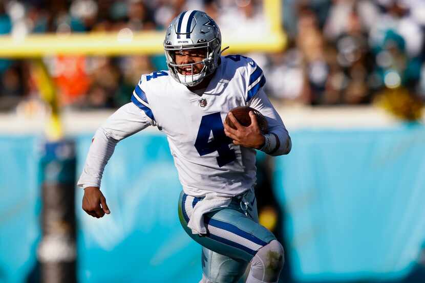 Dallas Cowboys quarterback Dak Prescott (4) runs with the ball during the second half of the...