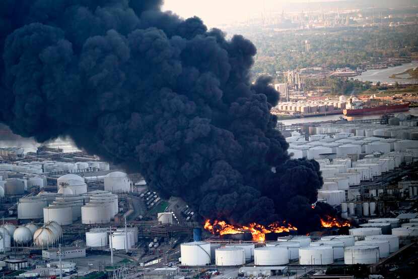 A plume of smoke rises from a petrochemical fire at the Intercontinental Terminals Co. on...