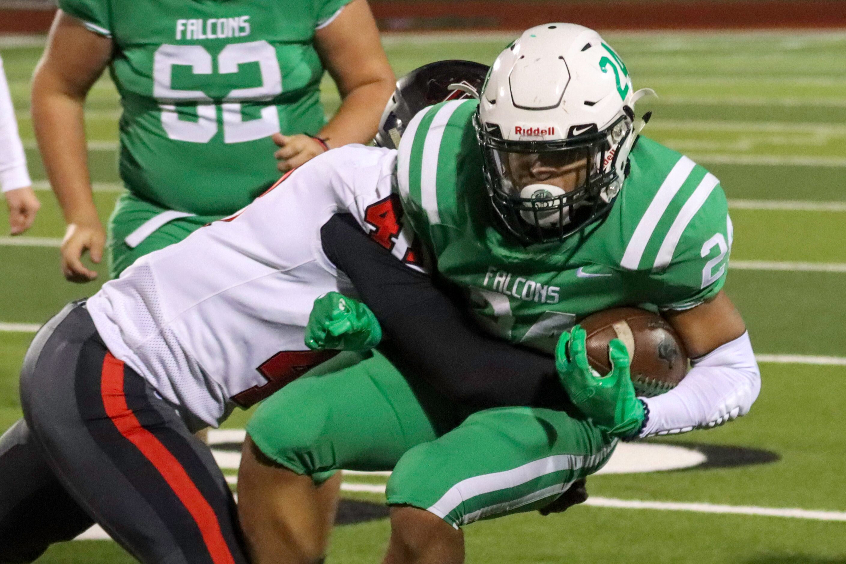 Frisco Liberty defensive lineman Jack Wilson (41) tackles Lake Dallas running back Aundre...