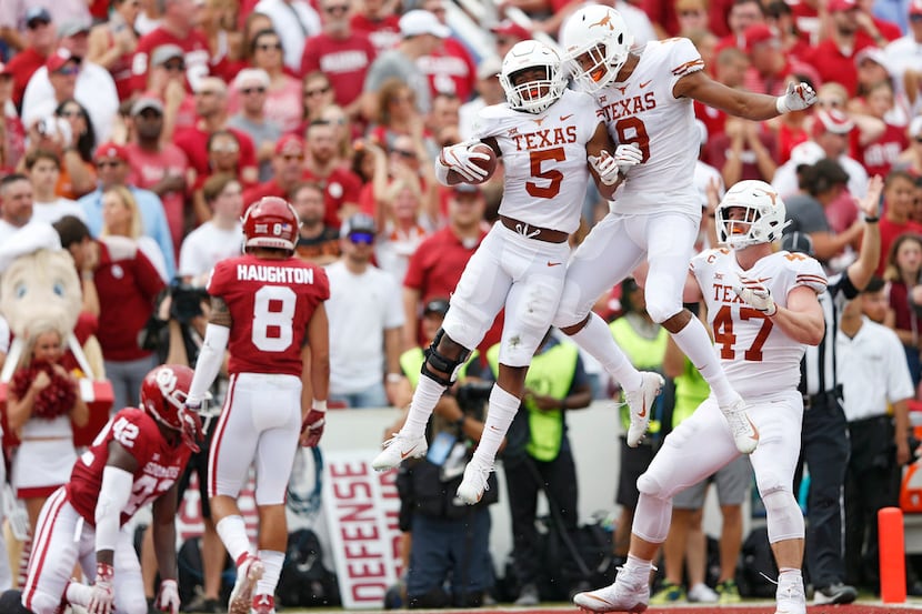 Texas Longhorns running back Tre Watson (5) celebrates with Texas Longhorns wide receiver...