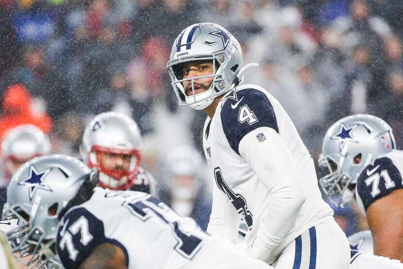 Dallas Cowboys quarterback Dak Prescott (4) looks down the offensive line during the first...