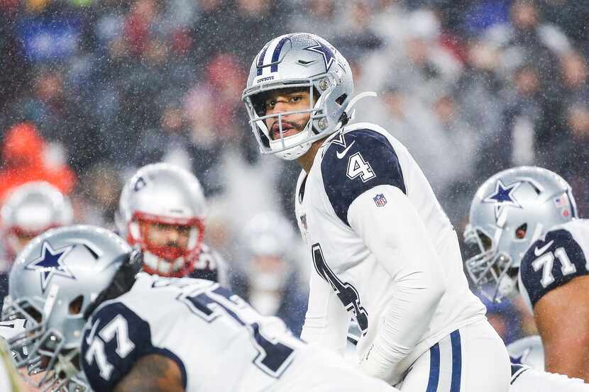 Dallas Cowboys quarterback Dak Prescott (4) looks down the offensive line during the first...