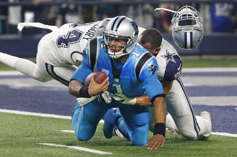 Carolina Panthers quarterback Cam Newton (1) is sacked by Dallas Cowboys defensive end Randy...