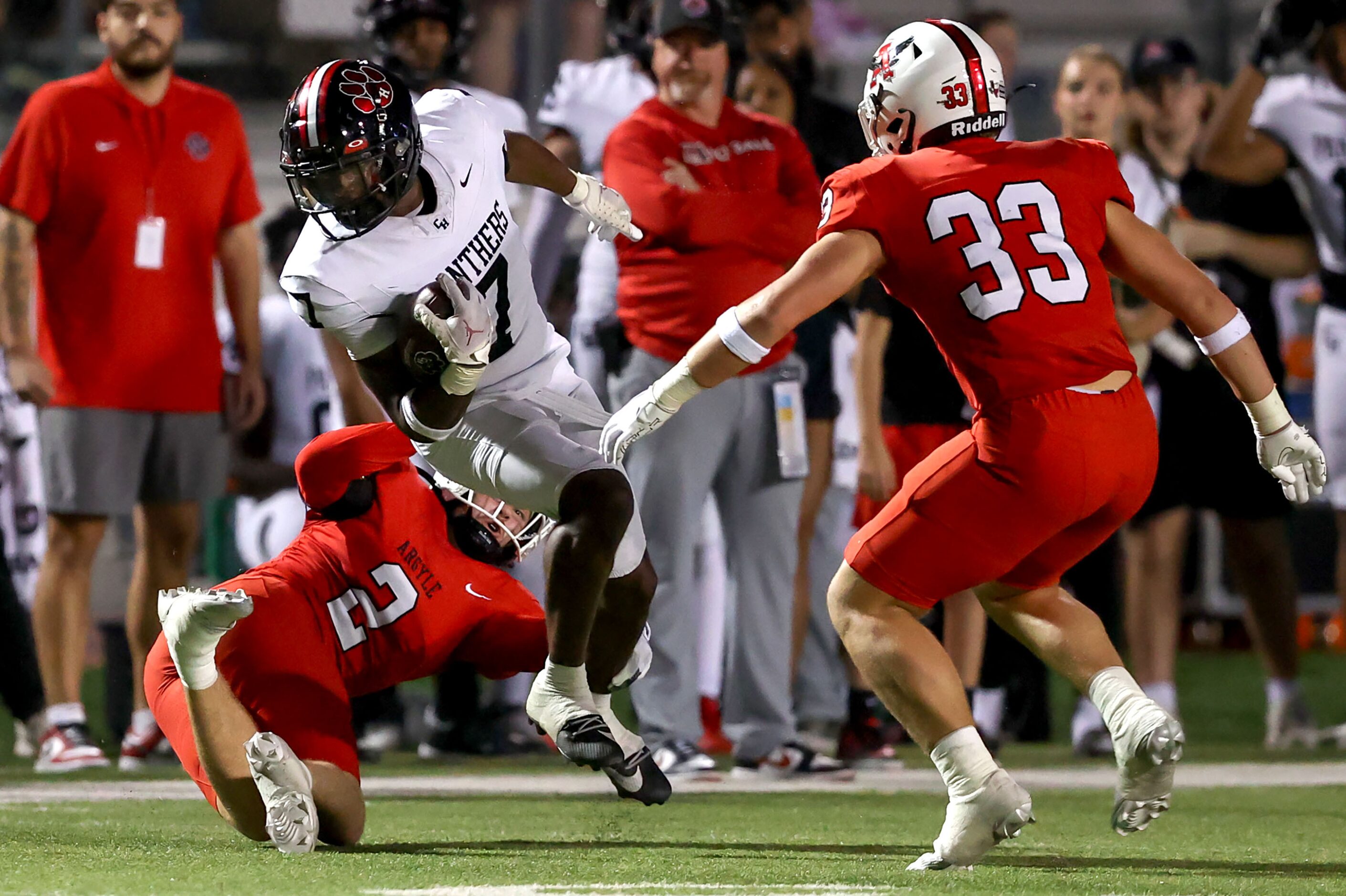 Colleyville Heritage wide receiver Hayden West (7) tries to avoid a tackle from Argyle...