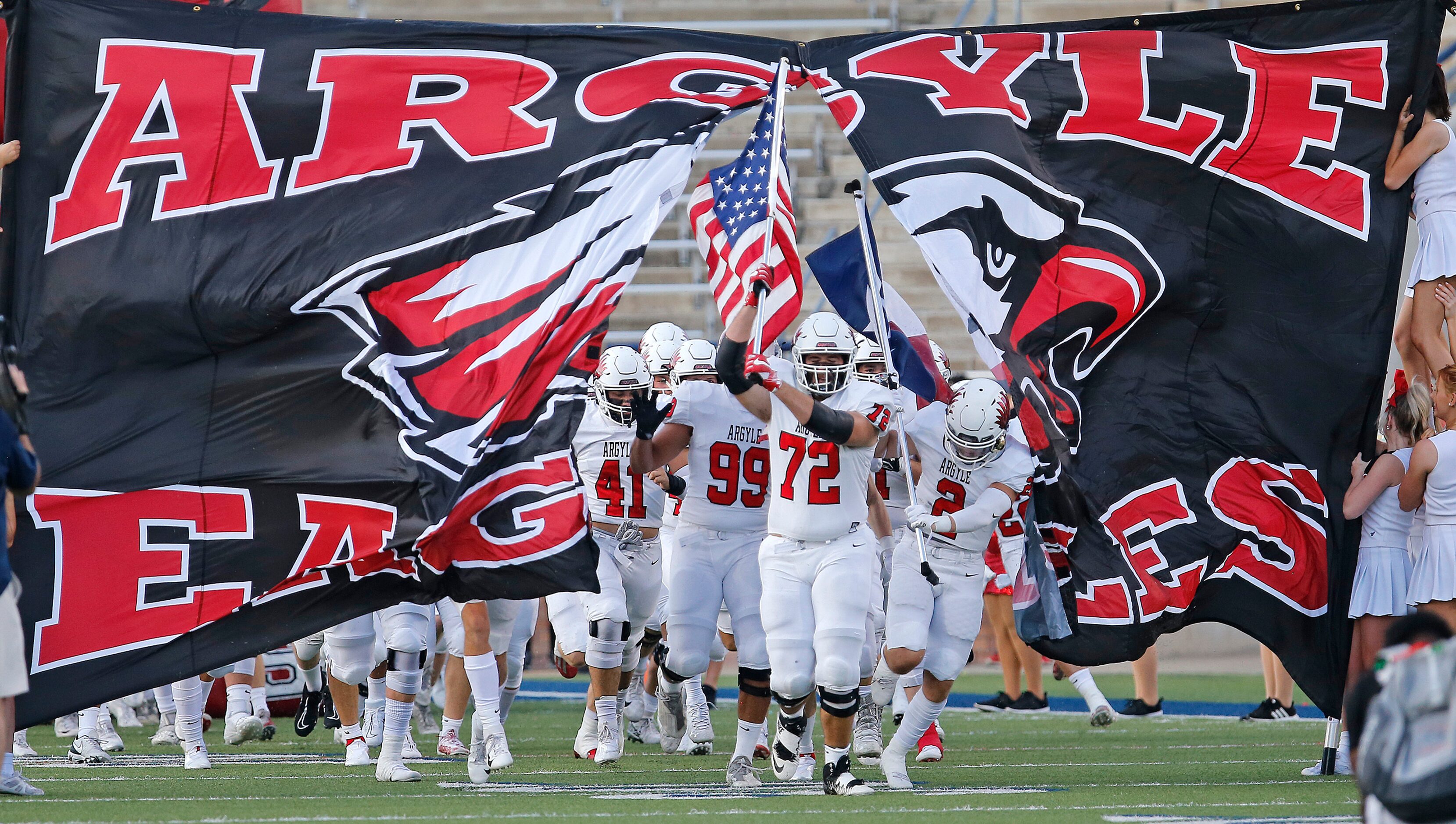 The Argyle High School football team takes the field before kickoff as they hosted Nolan...