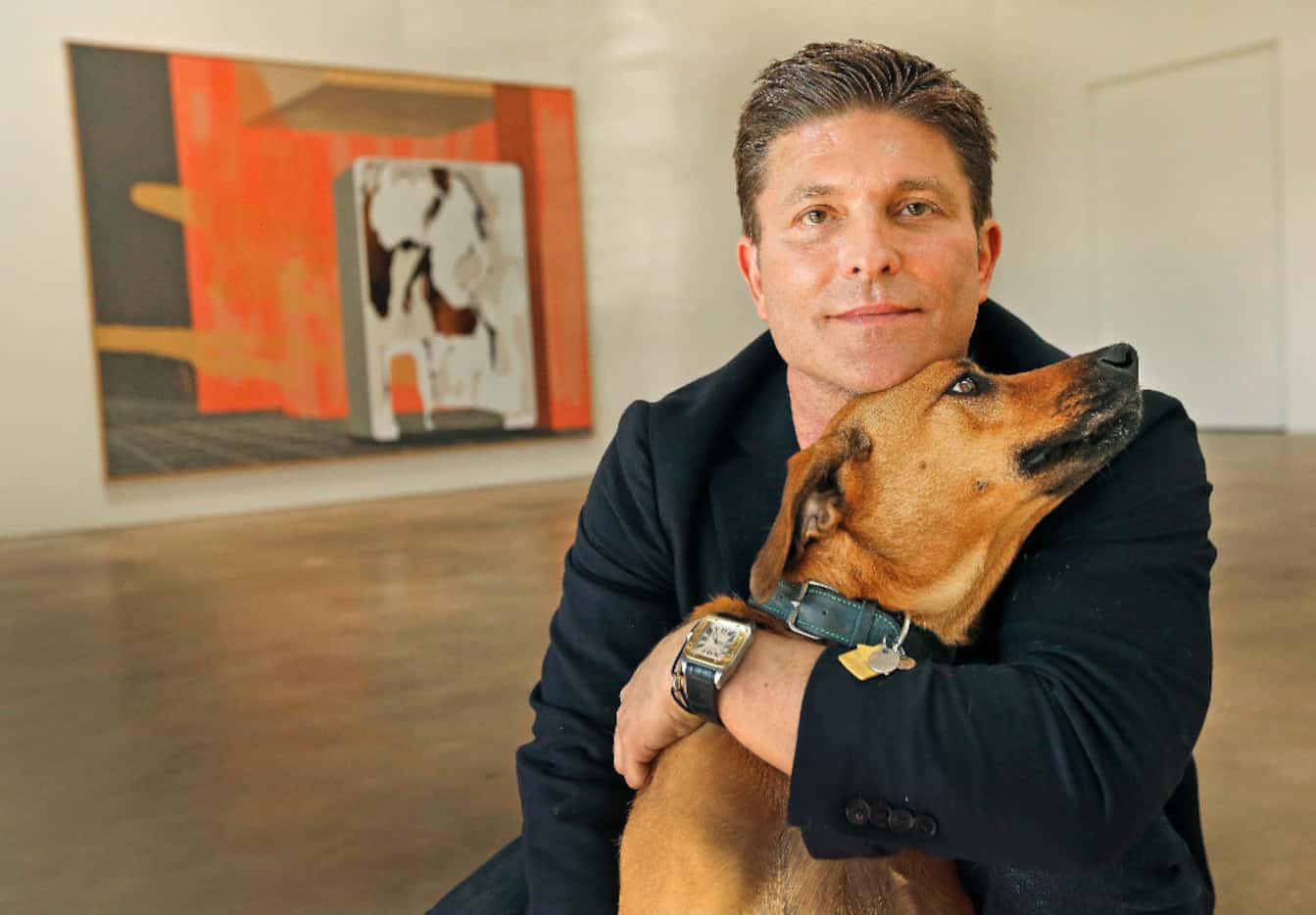 Kenny Goss is pictured with his dog Dixie at the Goss-Michael Foundation in Dallas. (Louis...
