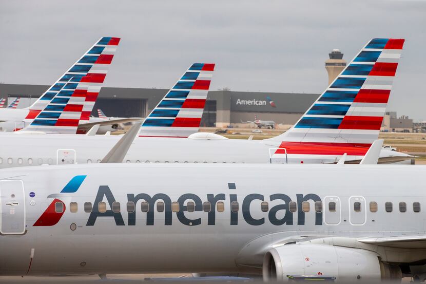 American Airlines planes parked at Terminal D at DFW International Airport.