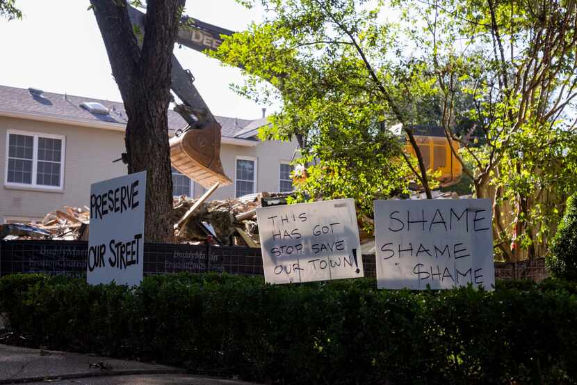 Signs shaming the demolition of the landmarked home at 4415 Fairfax Avenue were posted next...