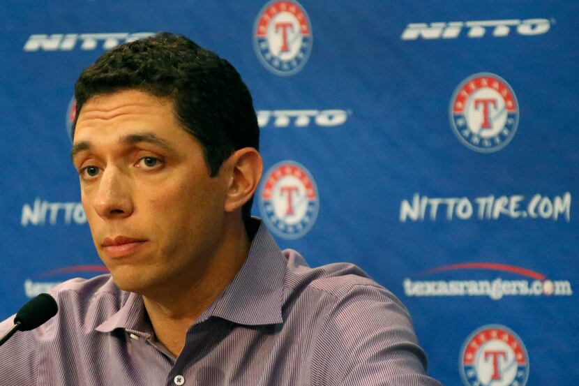 General Manager Jon Daniels makes a phone call during Texas Rangers Spring Training at their...