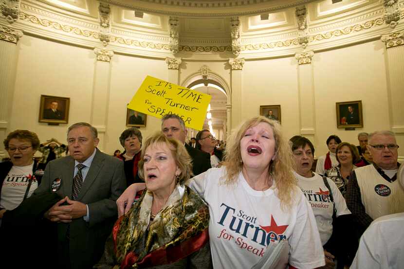 Cathie Adams  (center) of Dallas, and Kat Fox of Mabank, show their support for Rep. Scott...