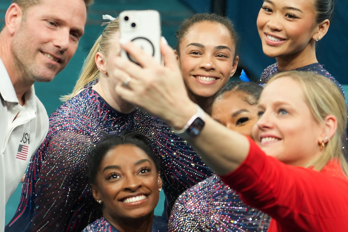 Hezly Rivera of the United States (top center) poses for a selfie with teammates (clockwise)...