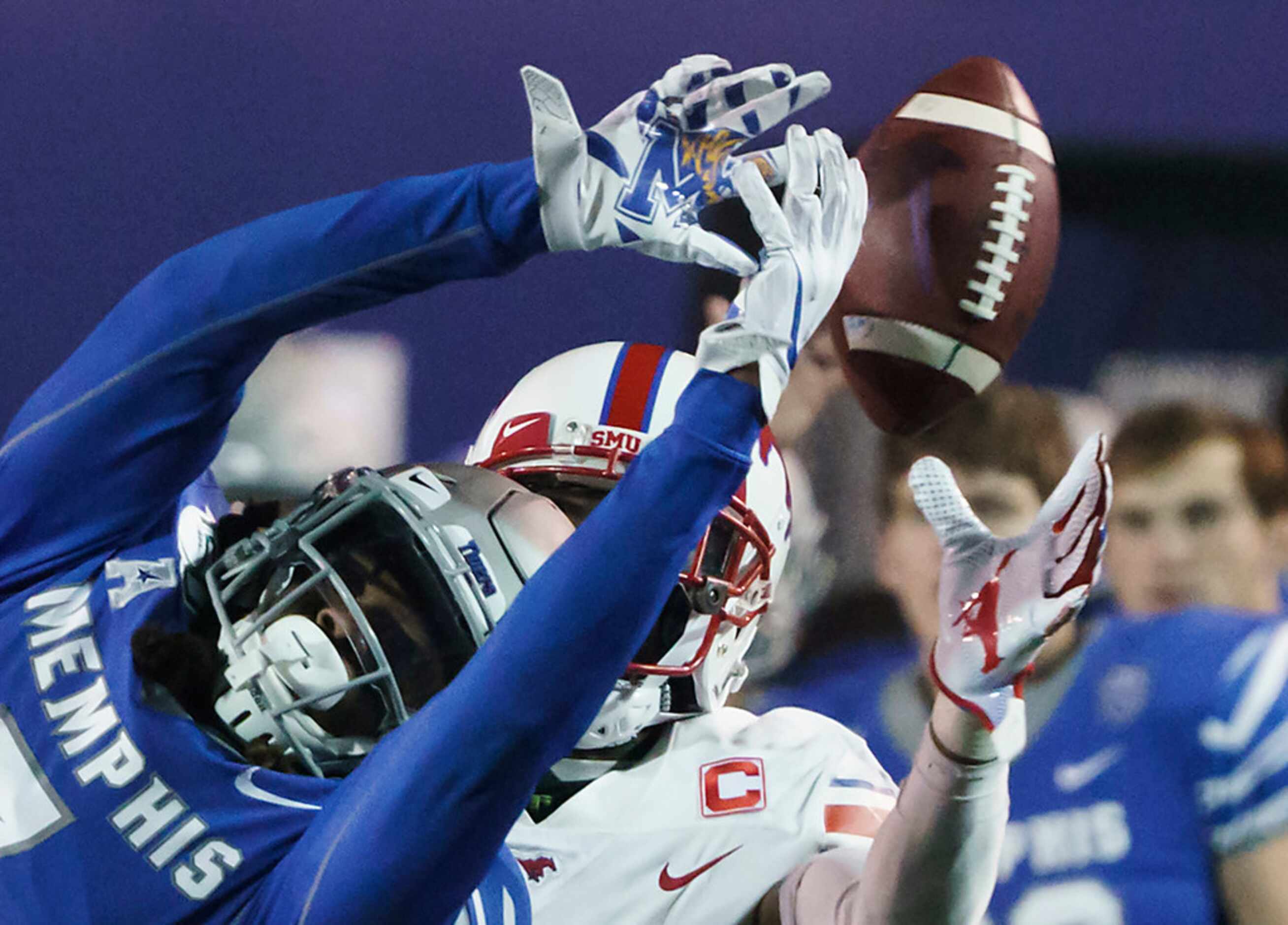 Memphis defensive back Chris Claybrooks (7) breaks up a pass intended for ]SMU wide receiver...