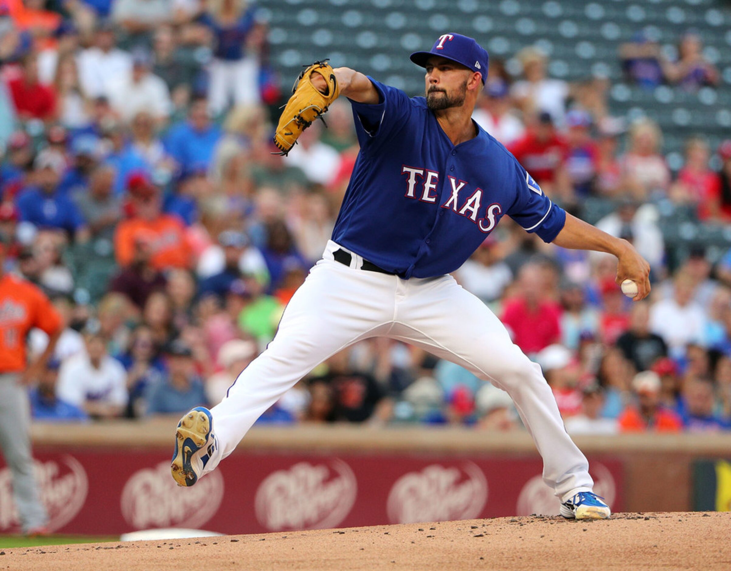 ARLINGTON, TX - AUGUST 04:  Mike Minor #36 of the Texas Rangers throws a pitch against the...