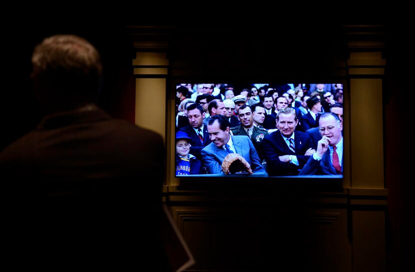 
A slideshow includes a picture of President Richard Nixon at a baseball game.
