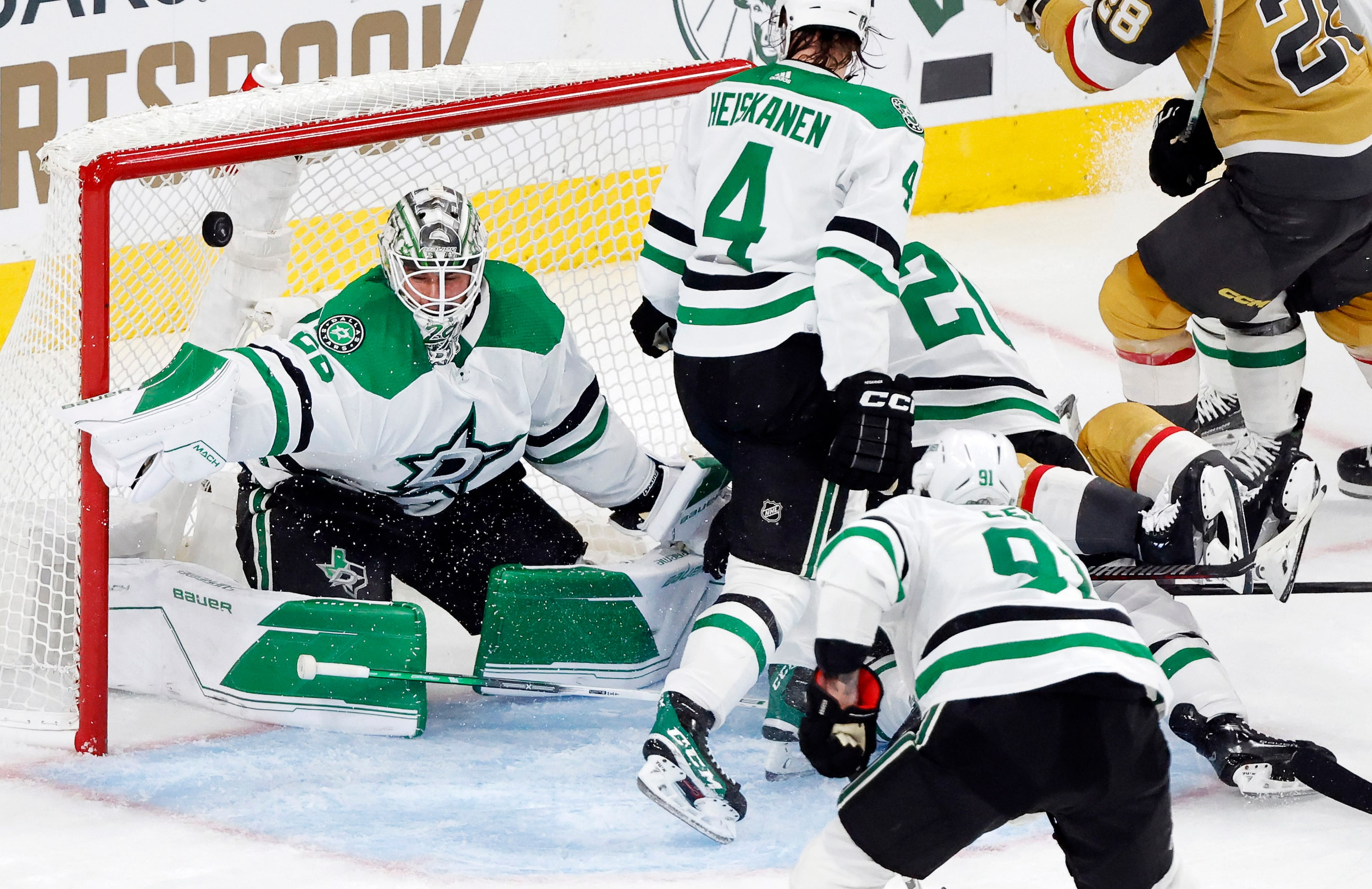 Dallas Stars goaltender Jake Oettinger (29) lets a rebound shot get past him by Vegas Golden...