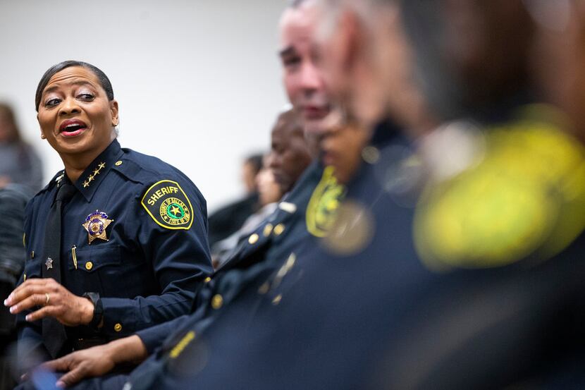 Sheriff Marian Brown laughs with deputies Tuesday morning before a ceremony at the Frank...