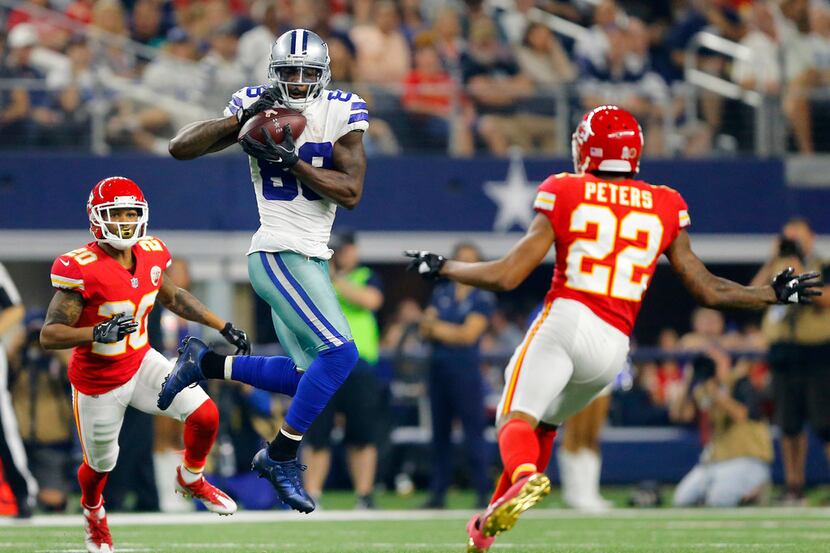 Dallas Cowboys wide receiver Dez Bryant (88) catches a pass across midfield before injuring...