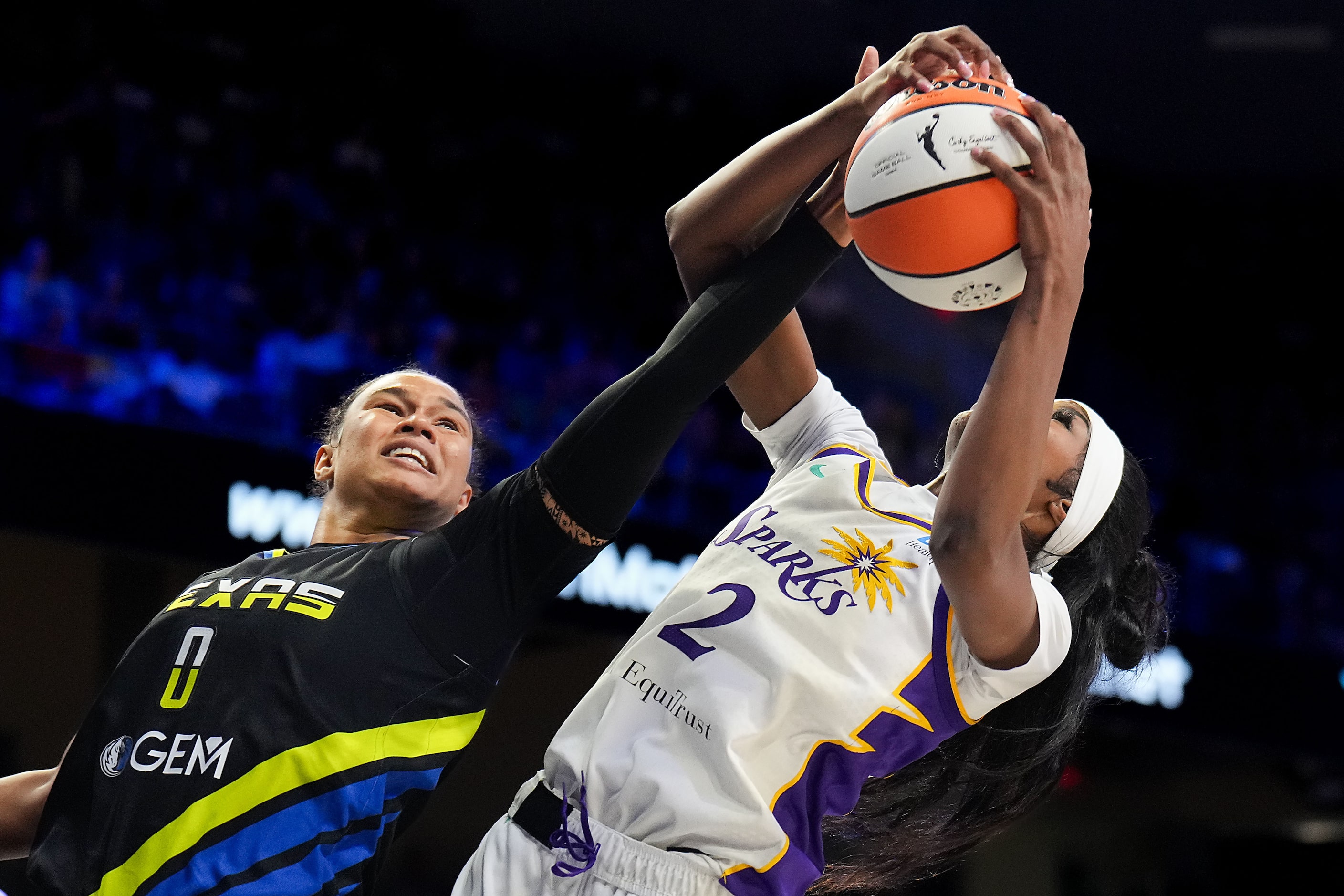 Dallas Wings forward Satou Sabally (0) fights for a rebound against Los Angeles Sparks...